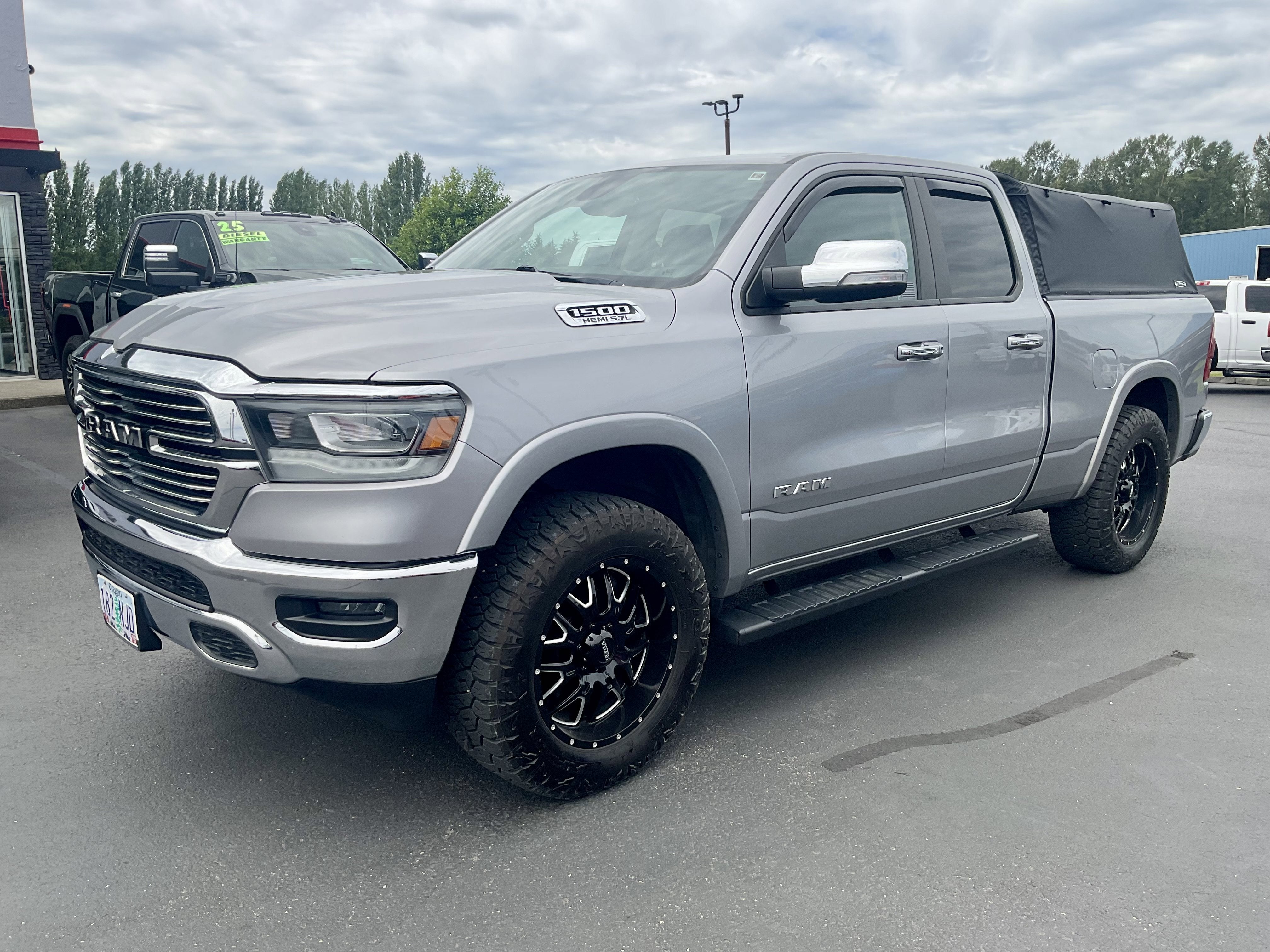 2020 RAM 1500 Laramie 4x4 in Billet Silver Metallic Clearcoat — front three-quarter view