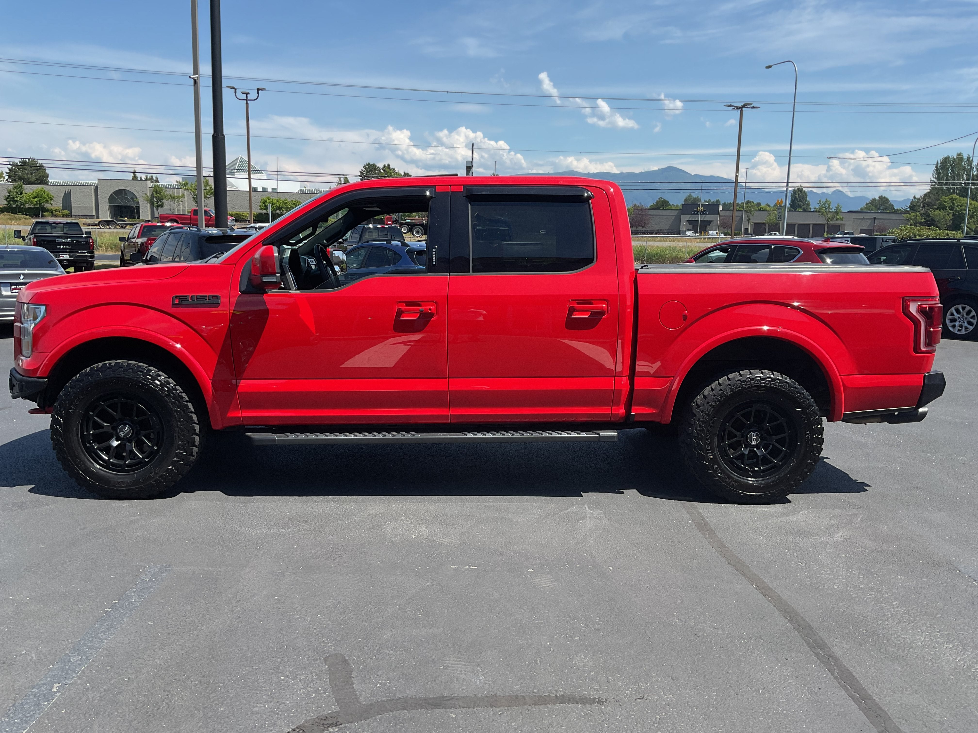 2015 Ford F-150 Lariat 4x4 in Red — front three-quarter view