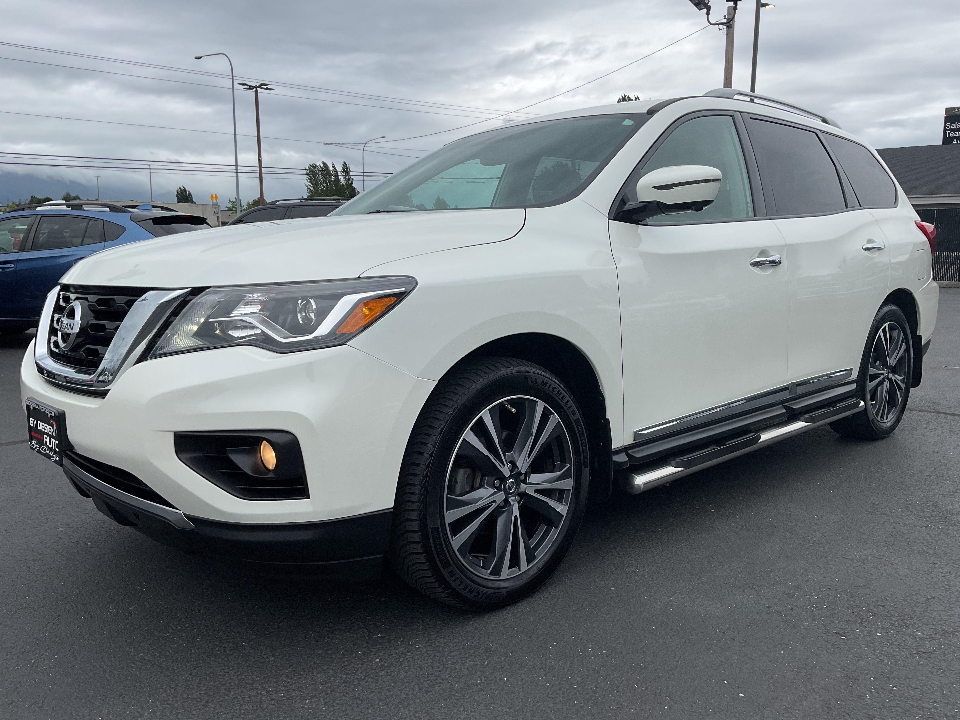 2017 Nissan Pathfinder Platinum 3rd row 4x4 in White — front three-quarter view