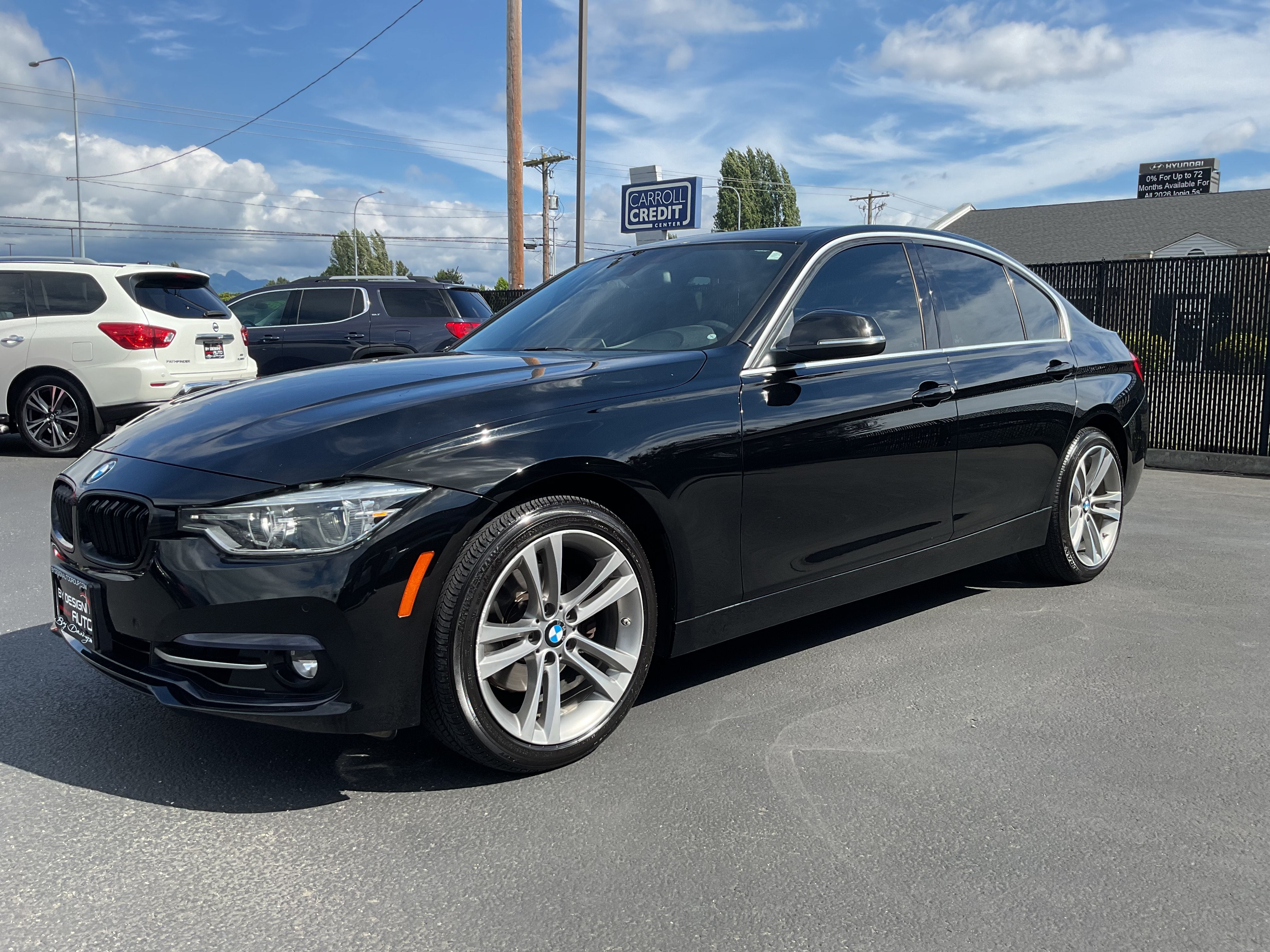 2017 BMW 3 Series 330i Sport xdrive AWD in Black — front three-quarter view